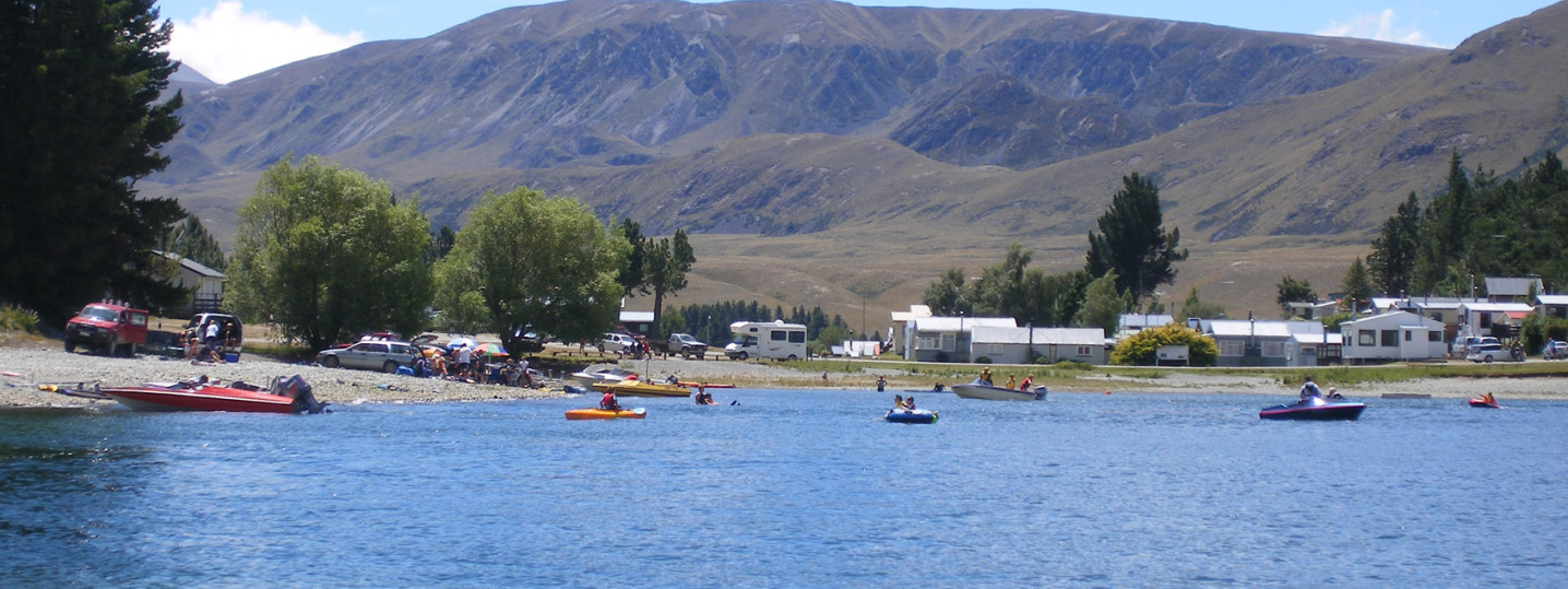 People canoeing and boating on a lake